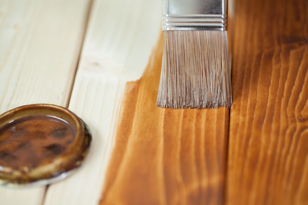 Painting wooden boards during renovation at home